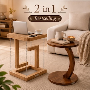 May include: A square wooden side table with a floating top suspended by four metal chains and a round wooden side table with a curved base. The square table holds a laptop and a coffee cup, while the round table holds a book and a candle.