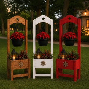 May include: Three tall wooden planter stands in brown, white, and red, each featuring a top arch with a star cutout, a hanging black pot with red poinsettias, and a base box containing a black lantern, pine branches, berries, and a snowflake.