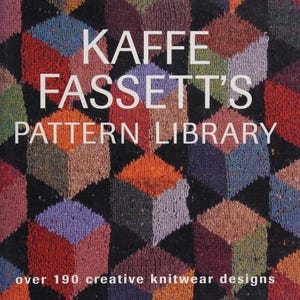 May include: A book cover featuring the title "KAFFE FASSETT'S PATTERN LIBRARY" in white text. The background is a repeating pattern of colorful, textured cubes in shades of red, orange, purple, and green. The text "over 190 creative knitwear designs" is also visible.