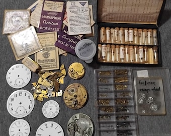 Lot of assorted antique pocket watch parts. Nos mainsprings, watch hands, train hole bushings, fine screws, dials & movements etc.