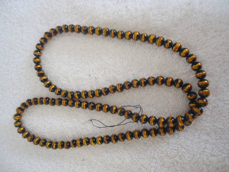 GB-26 8mm Black Glass Beads w Gold Foil 32 Long Strand
