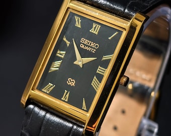 Reloj Seiko Slim Tank de cuarzo vintage – esfera negra con números romanos – Restaurado – Reloj clásico unisex