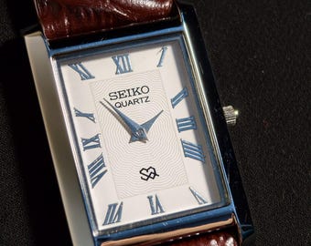 Reloj Seiko Slim Tank vintage con esfera blanca, pieza única.
