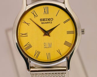 Reloj Seiko Slim Tank de cuarzo vintage – esfera amarilla con números romanos – Restaurado – Reloj clásico unisex