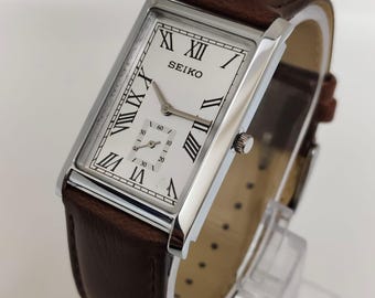 Reloj Seiko Slim Tank de cuarzo vintage – esfera blanca con números romanos – Restaurado – Reloj clásico unisex