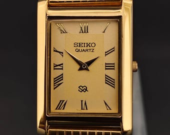 Reloj Seiko Slim Tank de cuarzo vintage – esfera naranja con números romanos – Restaurado – Reloj clásico unisex