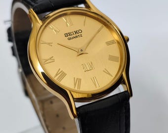 Reloj Seiko Slim Tank de cuarzo vintage – esfera dorada con números romanos – Restaurado – Reloj clásico unisex