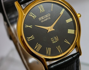 Reloj Seiko Slim Tank de cuarzo vintage – esfera negra con números romanos – Restaurado – Reloj clásico unisex