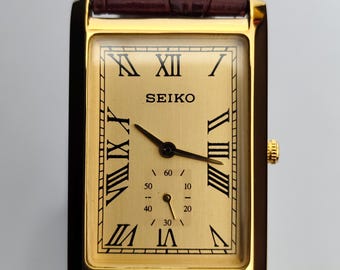 Reloj Seiko Slim Tank de cuarzo vintage – esfera dorada con números romanos – Restaurado – Reloj de vestir clásico