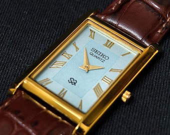 Reloj Seiko Slim Tank de cuarzo vintage – esfera azul con números romanos – Restaurado – Reloj de vestir clásico unisex
