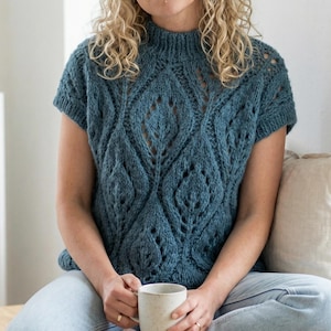 May include: A set of three ceramic mugs with a speckled, matte finish in cream, light grey, and dark grey. Each mug has a simple, minimalist design, suitable for coffee or tea.