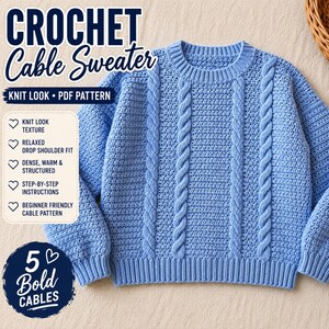 May include: A light blue crochet cable sweater with a knit look and a relaxed drop shoulder fit. The sweater features five bold cable designs and is made with a dense, warm, and structured texture. The image includes the text "CROCHET Cable Sweater".