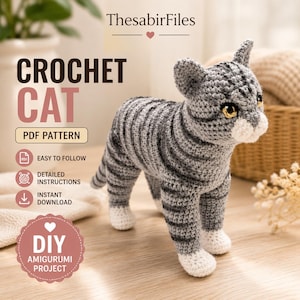 May include: A gray and white striped crochet cat amigurumi toy with yellow eyes. The image includes text: ThesabirFiles, CROCHET CAT, PDF PATTERN, EASY TO FOLLOW, DETAILED INSTRUCTIONS, INSTANT DOWNLOAD, and DIY AMIGURUMI PROJECT.