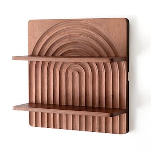 May include: A wooden wall shelf with two shelves. The shelf has a unique design with a series of arches carved into the wood. The shelf is a rich brown color.