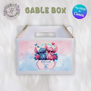 May include: White gable box with a handle, featuring a colorful illustration of two cartoon characters, a blue one and a pink one, with a rainbow and butterflies. The box has the text "GABLE BOX" and "Olivia Turns 6".