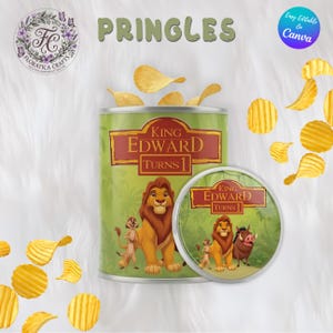 May include: A green Pringles can and lid featuring a Lion King theme with the text "King Edward Turns 1". The can is decorated with illustrations of Simba, Timon, and Pumbaa. Several potato chips are scattered around the can.