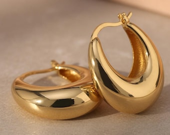 Złote kolczyki-koła w kształcie łezki 14K, masywne, błyszczące, minimalistyczne, wyraziste