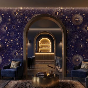 May include: An interior design featuring a celestial theme. The walls are adorned with a navy blue wallpaper patterned with gold moons, stars, and eye symbols. The room includes armchairs, a coffee table, and a bar area.