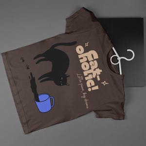 May include: A set of three ceramic mugs with a speckled, matte finish. The mugs are in shades of cream, light gray, and dark gray. Each mug has a simple, minimalist design, perfect for coffee or tea.