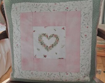 Hand stitched patchwork cushion cover . Heartfelt !
