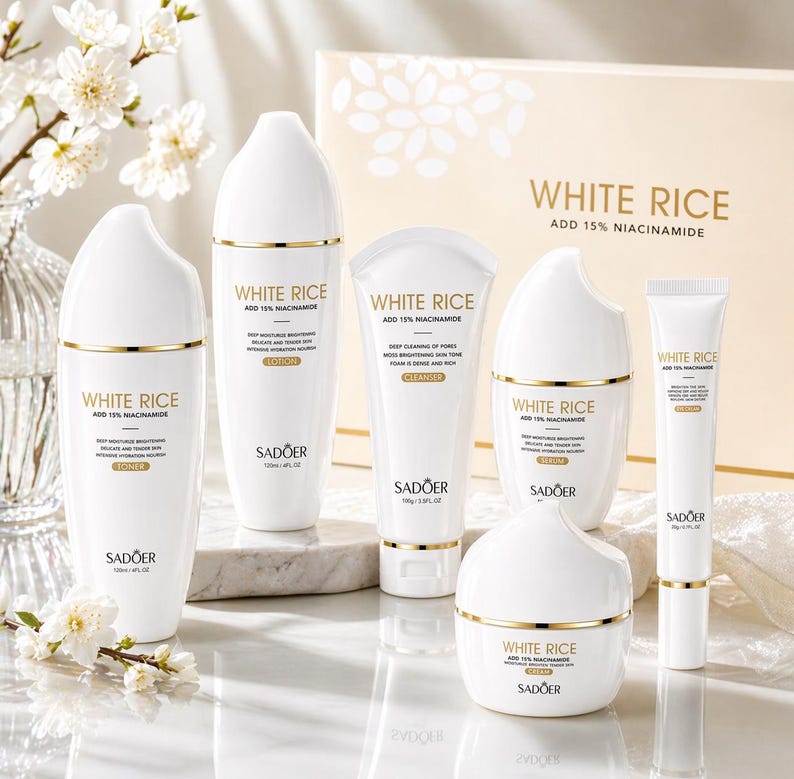 May include: A collection of white skincare products with gold accents, including toner, lotion, cleanser, serum, and cream. The packaging features the text "WHITE RICE ADD 15% NIACINAMIDE" and the brand name "SADOER". The products are arranged on a reflective surface.