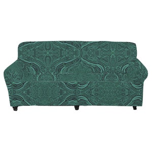 May include: A teal green sofa with a patterned fabric cover. The sofa has a classic design with a high back and armrests.