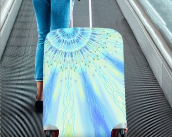 May include: A blue and yellow luggage cover with a mandala design. The cover is on a suitcase with wheels.
