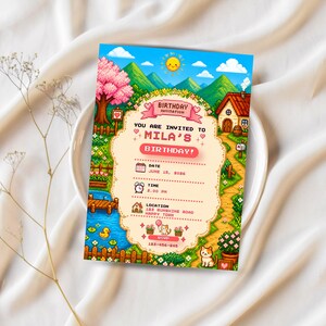 May include: A rectangular birthday invitation card featuring pixel art of a sunny landscape with green mountains, a pink cherry blossom tree, a small house, a pond with a yellow duck, and a cat. The text reads Mila's Birthday, June 15, 2026, 3:00 PM.