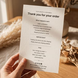 May include: A rectangular off-white card with black text titled Thank you for your order. It outlines order confirmation, processing time, production, packaging, shipping, important tracking information, and FAQ details, ending with social media handles.