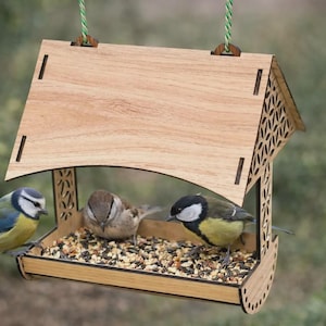 May include: A set of three ceramic mugs with a speckled, matte finish. The mugs are in shades of cream, light gray, and dark gray. Each mug has a simple, minimalist design, perfect for coffee or tea.