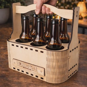 May include: A wooden beer caddy holding six brown glass bottles. The caddy is made of light-colored wood with a handle and a decorative label. The bottles are filled with a dark liquid.