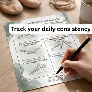 May include: A fitness tracker with exercise diagrams and the text "Track your daily consistency." The tracker features illustrations for exercises like hollow body rocks and prone back exercises. A hand is holding a black pen, ready to mark the daily tracker.