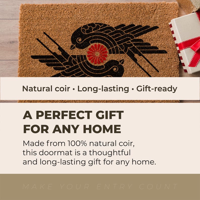 May include: A rectangular natural coir doormat featuring a black graphic print of two stylized birds facing each other with a red circular floral emblem positioned between them. The mat has a coarse, fibrous texture and a light brown tan color.