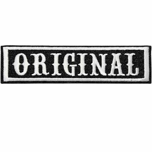 May include: A rectangular embroidered patch featuring a black background with a white border. The word ORIGINAL is stitched in white capital letters across the center in a serif font. The patch has a clean, finished edge and a flat design.