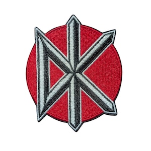 May include: Embroidered patch featuring a geometric design in black, white, and gray, set against a vibrant red circular background. The patch has a detailed, textured appearance, suitable for application on clothing or accessories.