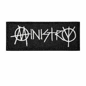 May include: A black rectangular patch with the word "MINISTRY" embroidered in white, stylized with unique symbols. The patch is a simple, yet bold design.