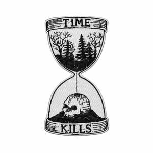 May include: An embroidered patch in the shape of an hourglass with black thread on a white background. The top bulb shows a forest scene, the bottom bulb contains a human skull, and the text reads TIME at the top and KILLS at the bottom.