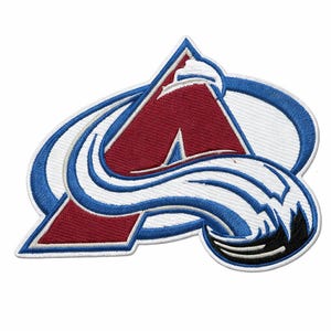 May include: Embroidered patch featuring the Colorado Avalanche logo. The logo is a stylized letter "A" in burgundy, with a blue and white design. The patch has a white border and is set against a white background.