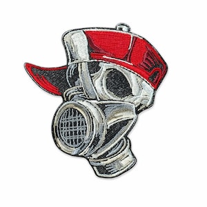 May include: Embroidered patch featuring a skull wearing a red and white baseball cap and a gas mask. The patch has a detailed design with black, white, and gray stitching. The patch is likely for jackets, bags, or other apparel.