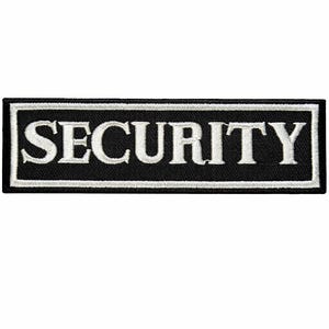 Puede incluir: Parche rectangular negro con la palabra «SECURITY» bordada en letras mayúsculas blancas. El parche tiene un borde blanco. El texto es claro y fácil de leer, diseñado para su aplicación en uniformes.