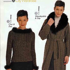 May include: Two women modeling brown knit sweaters with fur trim. The sweater on the left is a shorter style with a fur collar and cuffs. The sweater on the right is a long cardigan with a fur collar and a tie belt.
