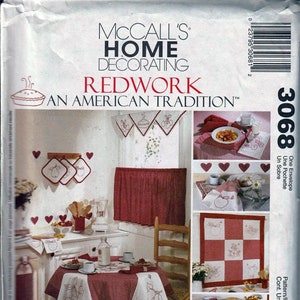 May include: A sewing pattern for a redwork embroidery project. The pattern includes instructions for making a table runner, placemats, a quilt block, and an apron. The pattern is titled "Redwork: An American Tradition".