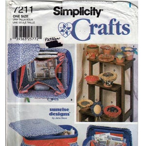 May include: A sewing pattern for crafting storage containers. The pattern includes instructions for making a blue and white fabric-covered storage bin with a red bow, a blue and white fabric-covered storage bin with a yellow bow, and a set of fabric-covered flower pots.