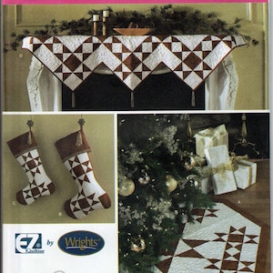 May include: Simplicity holiday quilting pattern featuring a mantel scarf, stockings, and a tree skirt. The designs use a brown and white geometric star pattern. The pattern includes the text "ONE SIZE" and "holiday quilting".
