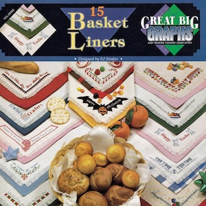 May include: A book cover featuring a collection of 15 basket liner designs. The image showcases various embroidered basket liners with different themes, including Halloween and Easter. A basket of bread is in the center.