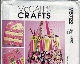 May include: A sewing pattern for a colorful striped and floral tote bag with pockets. The pattern is McCall's Crafts M5722 Size OSZ.