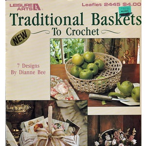 May include: A crochet pattern booklet for making traditional baskets. The cover features a photo of three crocheted baskets, one filled with apples, one with a bow and lace, and one hanging on a door with flowers.