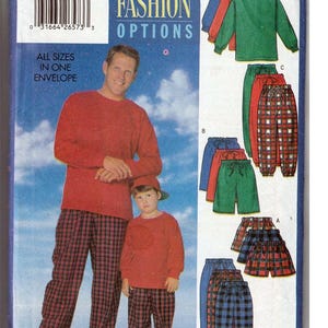 May include: A vintage Butterick sewing pattern envelope, featuring a man and child in matching red tops and plaid pants. The pattern offers unlimited fashion options, including tops and shorts. The text "FAST & EASY" is visible at the bottom.