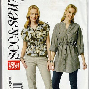 May include: A sewing pattern package with the text "see & sew" and "YES! IT'S EASY". The package features two women modeling different shirt designs. One shirt is patterned, and the other is solid gray.
