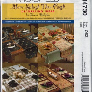 May include: A McCall's pattern for decorating ideas by Donna Babylon. The image shows various reversible tabletop items, including placemats and table runners. The designs feature floral, plaid, and patterned fabrics, with coordinating napkins and place settings.
